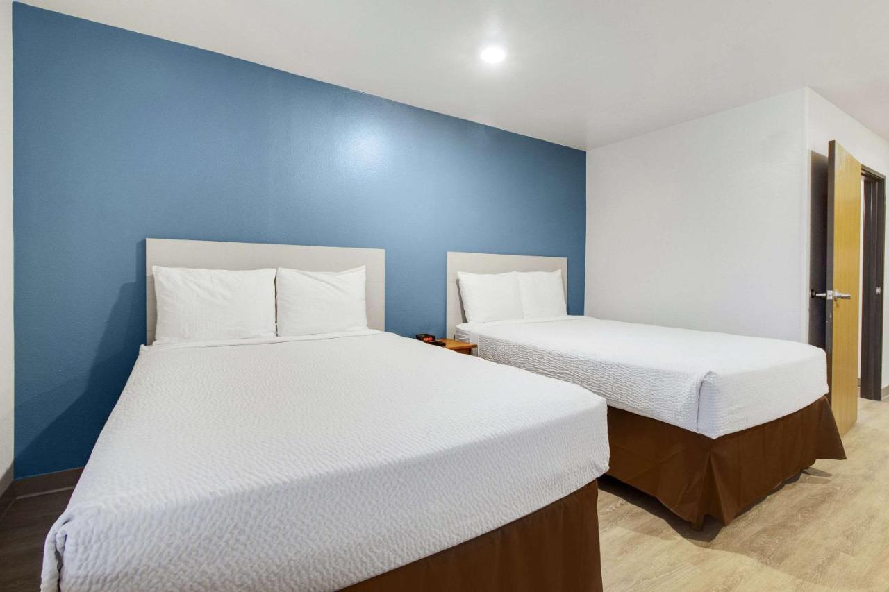 Woodspring Suites Conroe Exterior photo